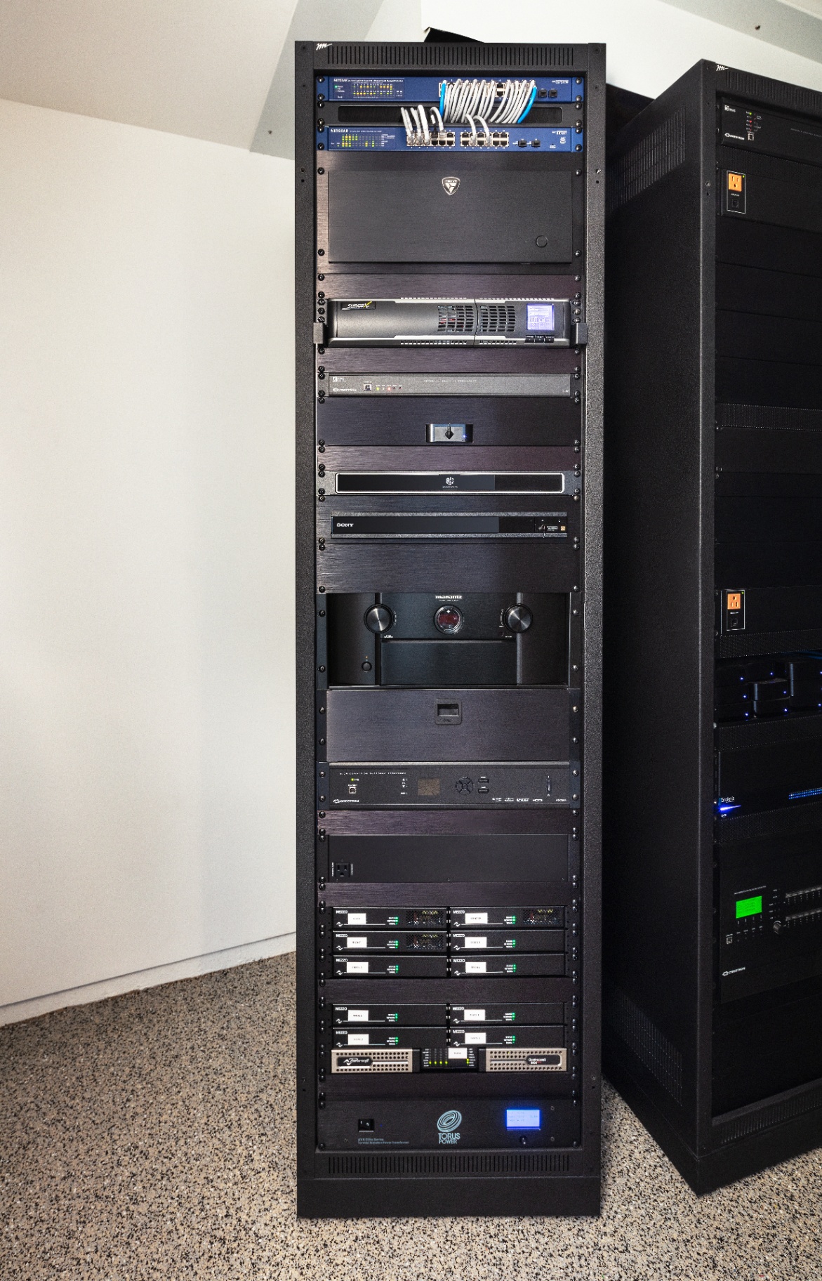 Front of the Eagle’s Nest equipment rack — the components that power the theater, neatly organized.